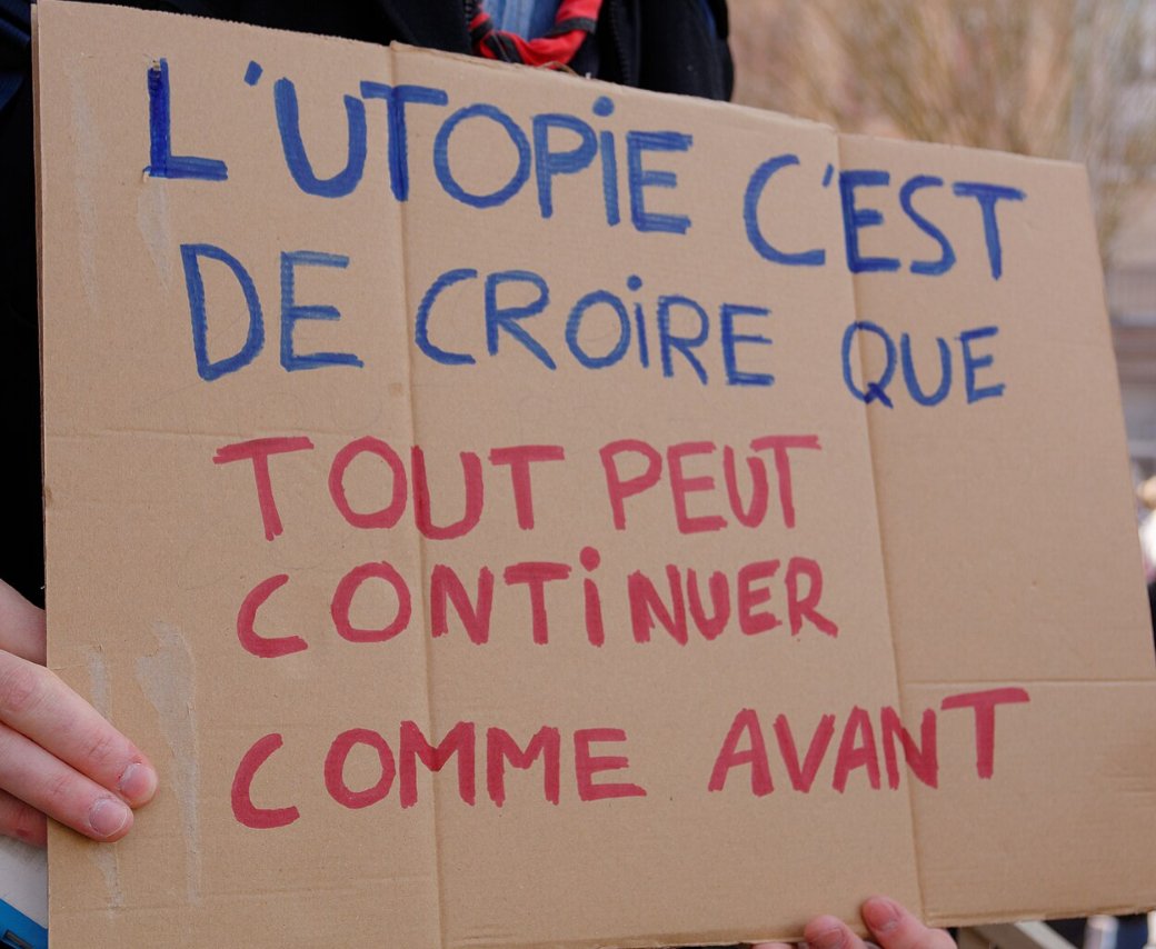 Pancarte « L'UTOPIE C'EST DE CROIRE QUE TOUT PEUT CONTINUER COMME AVANT », Belfort (90), 16 mars 2019